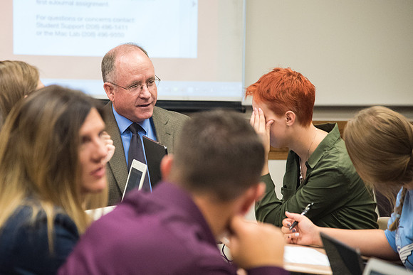 Students learn about College Success from Mark Orchard and their classmates through group discussions.