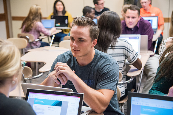 Students learn about College Success from Mark Orchard and their classmates through group discussions.