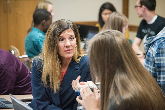 Students learn about College Success from Mark Orchard and their classmates through group discussions.