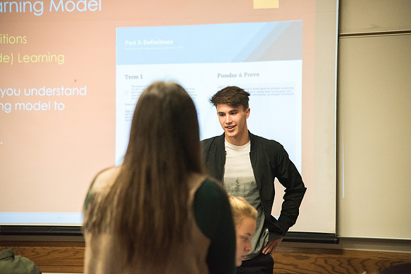 Students learn about College Success from Mark Orchard and their classmates through group discussions.