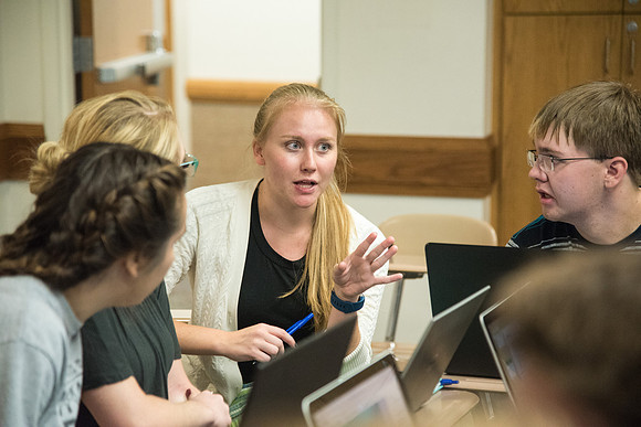 Students learn about College Success from Mark Orchard and their classmates through group discussions.