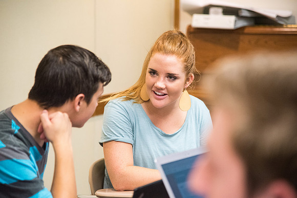 Students learn about College Success from Mark Orchard and their classmates through group discussions.