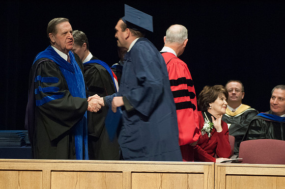 Dec 2006 Elder Holland & grad Corey Blackburn