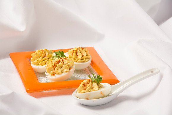 Filled with the hard-bolied egg yolk, mixed with mayonnaise and mustard.
