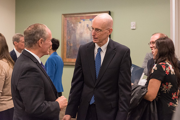 President Henry J. Eyring speaks with guests in the Green Room before his Inauguration. 2017