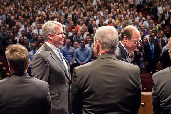 Brother Stephen Owen walks across the stage at the start of Inauguration.