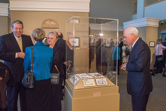 Friends and family gather in the Spori Art Gallery where President Henry B. Eyring's artwork is on display. Sept 19, 2017.