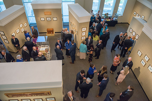 Friends and family gather in the Spori Art Gallery where President Henry B. Eyring's artwork is on display. Sept 19, 2017.