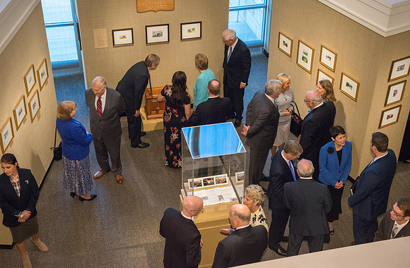 Friends and family gather in the Spori Art Gallery where President Henry B. Eyring's artwork is on display. Sept 19, 2017.