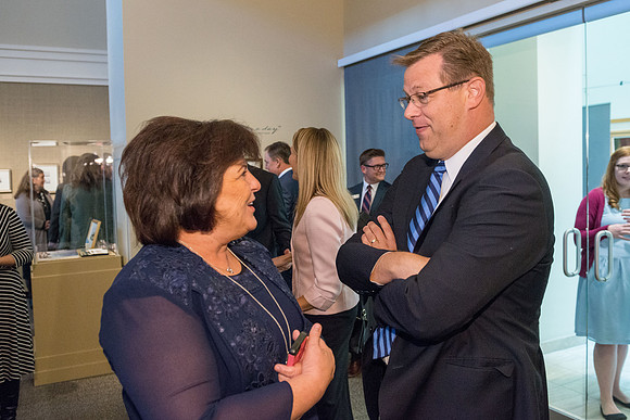 Friends and family gather in the Spori Art Gallery where President Henry B. Eyring's artwork is on display. Sept 19, 2017.