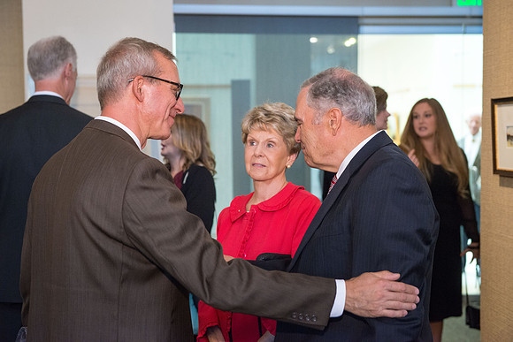 Friends and family gather in the Spori Art Gallery where President Henry B. Eyring's artwork is on display. Sept 19, 2017. Kelly Burgener with the Bennions