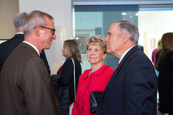 Friends and family gather in the Spori Art Gallery where President Henry B. Eyring's artwork is on display. Sept 19, 2017. Kelly Burgener with the Bennions