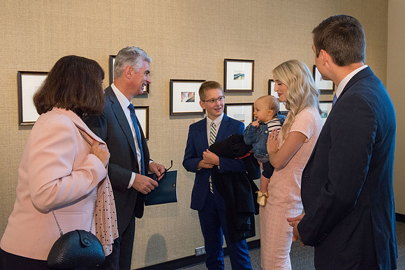 Friends and family gather in the Spori Art Gallery where President Henry B. Eyring's artwork is on display. Sept 19, 2017.