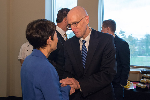Friends and family gather in the Spori Art Gallery where President Henry B. Eyring's artwork is on display. Sept 19, 2017. President Henry J Eyring and Sister Bednar
