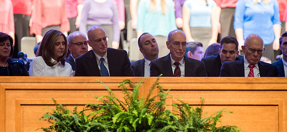 Sister Kelly Eyring, President Henry J. Eyring, President Henry B. Eyring, and Elder Dallin H. Oaks watch the Choir sing the final Musical Number, "Come Thou Fount of Every Blessing."