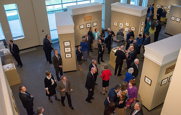 Friends and family gather in the Spori Art Gallery where President Henry B. Eyring's artwork is on display. Sept 19, 2017.