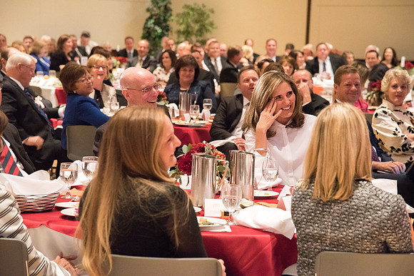 Elder David A. Bednar reminds Sister Kelly C. Eyring and recalls her time as a "BYU Cougarette" at the Inauguration Luncheon held in the MC Ballroom.
