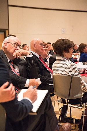 Elder Dallin H. Oaks listens as Elder David A. Bednar speaks at the Inauguration Luncheon held in the MC Ballroom.