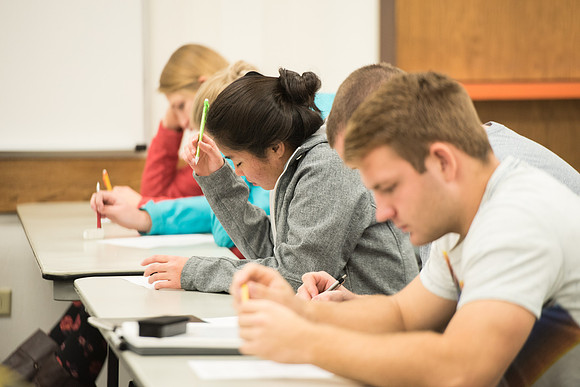 Todd Kelson teaches Biology students about Genetics and Molecular Biology.