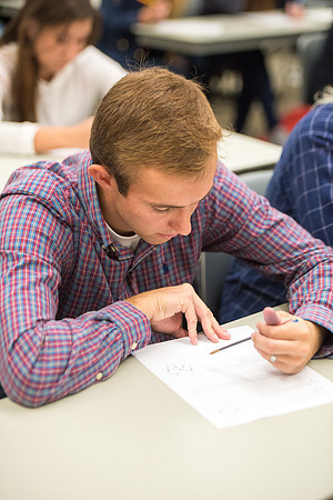 Todd Kelson teaches Biology students about Genetics and Molecular Biology.