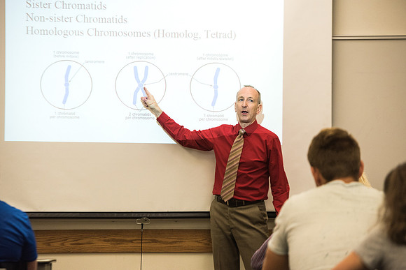 Todd Kelson teaches Biology students about Genetics and Molecular Biology.