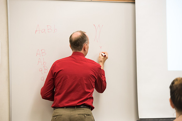 Todd Kelson teaches Biology students about Genetics and Molecular Biology.