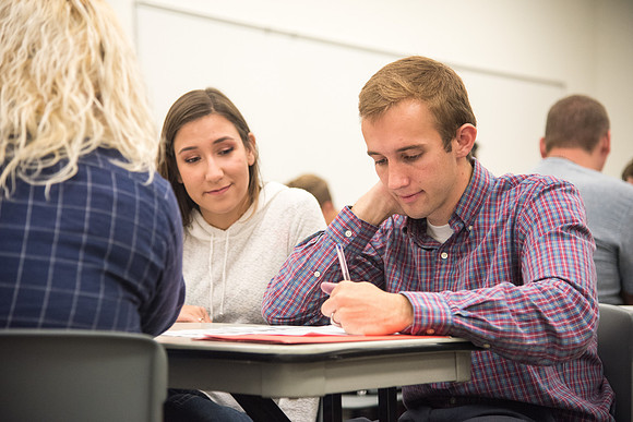 Todd Kelson teaches Biology students about Genetics and Molecular Biology.