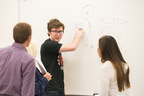 Todd Kelson teaches Biology students about Genetics and Molecular Biology.