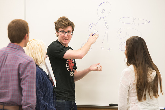 Todd Kelson teaches Biology students about Genetics and Molecular Biology.