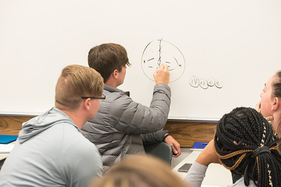 Todd Kelson teaches Biology students about Genetics and Molecular Biology.