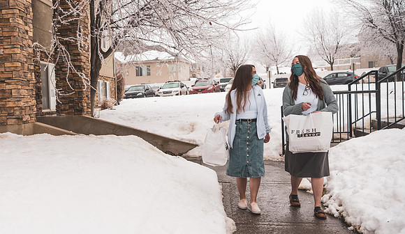 Students help distribute meals for a campus wide break the fast.