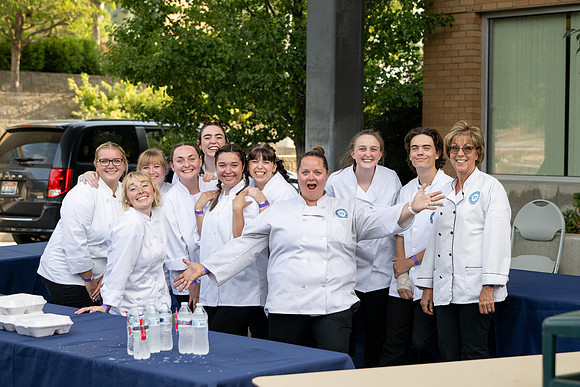 Family & consumer science catering team at the spring semester fashion show in the McKay Ampitheater.