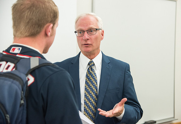 Greg Hazard helps new freshman learn how to be better learners in a Study Skills class.