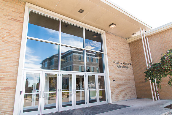 The west entrance of the Kirkham Building with the Spori reflection in the window.