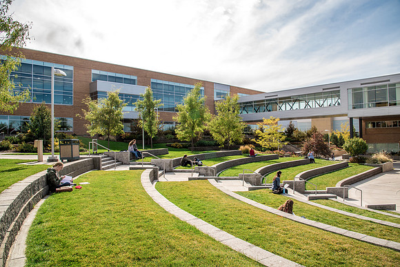 Students enjoy the sun in the Ampitheatre.