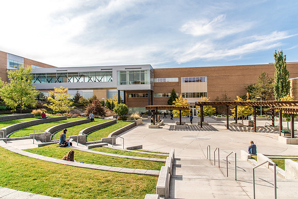 Students enjoy the sun in the Ampitheatre.