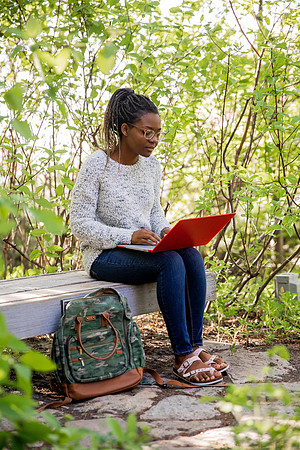 Students Abby Anderson, Miriam Akulu and Sariah Beasley studying and spending time in the gardens at BYUI.