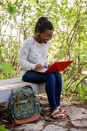 Students Abby Anderson, Miriam Akulu and Sariah Beasley studying and spending time in the gardens at BYUI.