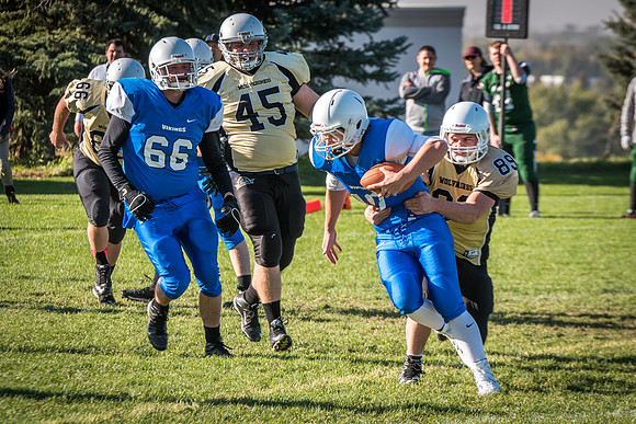 Students play a game of football on the upper-fields. Vikings vs Wolverines. 2017