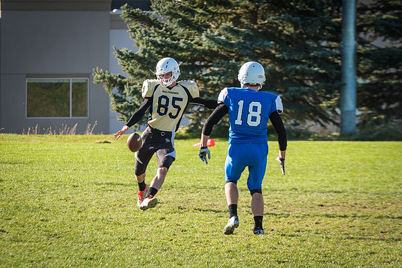 Students play a game of football on the upper-fields. Vikings vs Wolverines. 2017