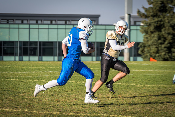 Students play a game of football on the upper-fields. Vikings vs Wolverines. 2017