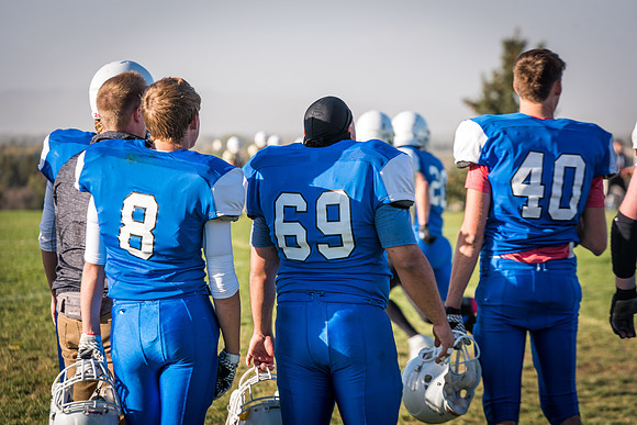 Students play a game of football on the upper-fields. Vikings vs Wolverines. 2017