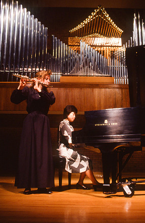 Students practicing piano and flute