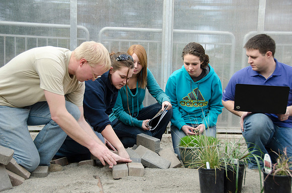 College horticulture class works with high school students to redesign the Clark playground facilities.