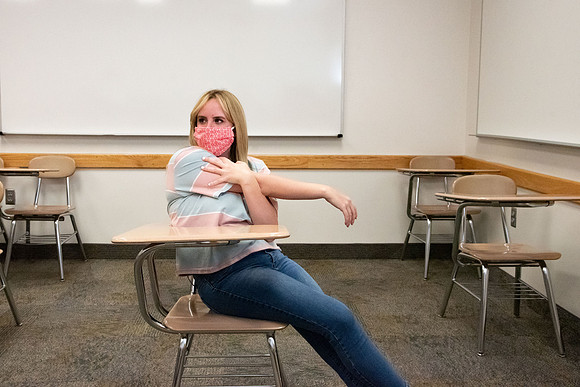 Examples of students staying safe and healthy during the COVID-19 pandemic by social distancing, following pathway arrows, and wearing face masks.