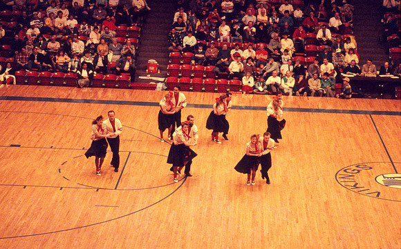 Ballroom dancers performing in gym. Feb 1990