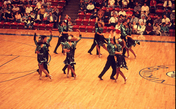 Ballroom dancers performing in gym. Feb 1990