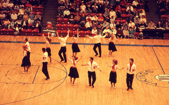 Ballroom dancers performing in gym. Feb 1990