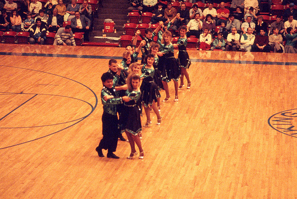 Ballroom dancers performing in gym. Feb 1990