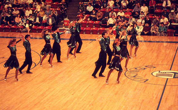 Ballroom dancers performing in gym. Feb 1990